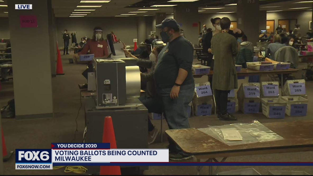 Volunteers begin counting absentee ballots in Milwaukee